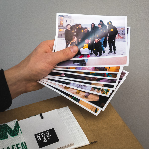 A set of photos printed on photo paper, giving visuall impressions of the workshops.